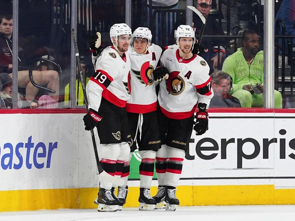  Senators forward Tim Stützle, centre, celebrates his game-winning goal in overtime with Drake Batherson (19) and Thomas Chabot (72) on Saturday.