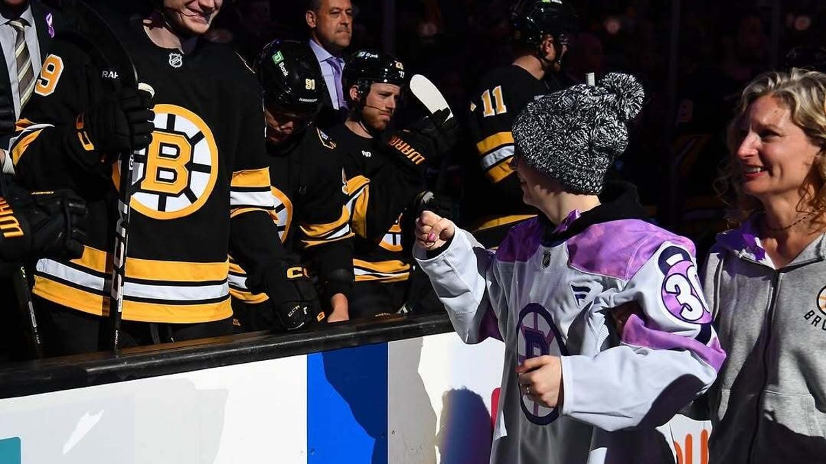 Emma Robertson, 16, performs ceremonial Bruins puck drop