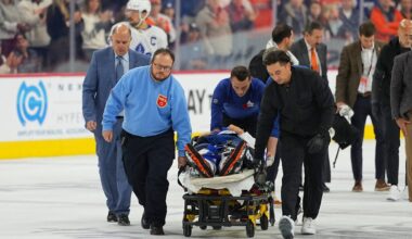 Maple Leafs' Chris Tanev leaves ice on stretcher after collision