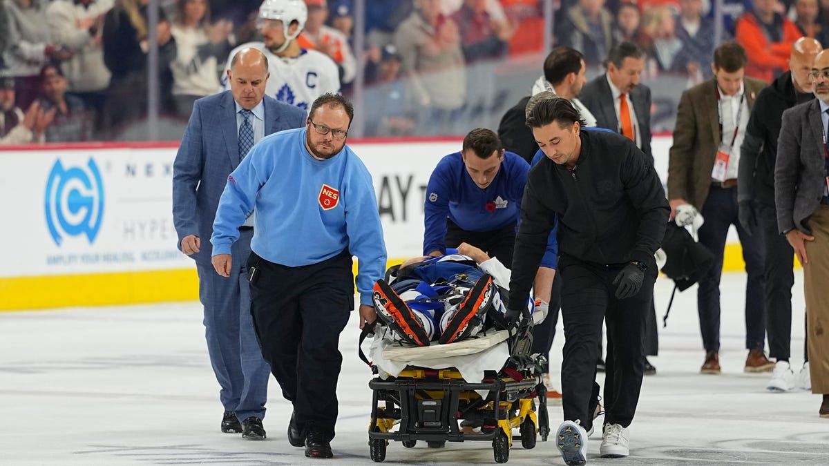 Maple Leafs' Chris Tanev leaves ice on stretcher after collision