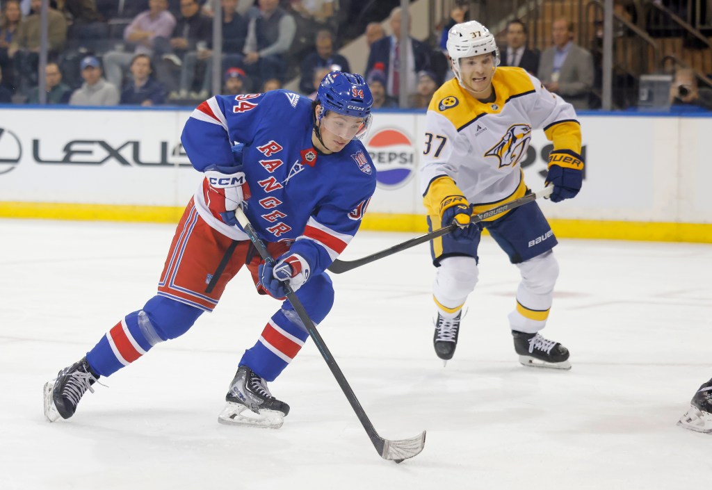 New York Rangers right wing Gabe Perreault (94) moves the puck down ice during the first period against the Nashville Predators.