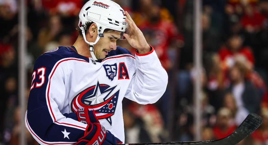 Nov 5, 2025; Calgary, Alberta, CAN; Columbus Blue Jackets center Sean Monahan (23) against the Calgary Flames during the first period at Scotiabank Saddledome.