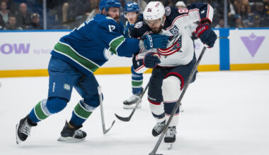 Nov 8, 2025; Vancouver, British Columbia, CAN; Vancouver Canucks defenseman Filip Hronek (17) checks Columbus Blue Jackets forward Kirill Marchenko (86) in the third period at Rogers Arena.