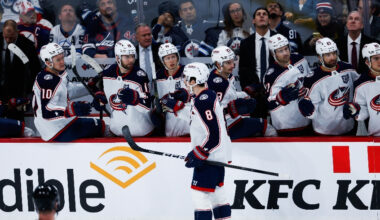 Nov 18, 2025; Winnipeg, Manitoba, CAN; Columbus Blue Jackets defenseman Zach Werenski (8) is congratulated by his team mates on his goal against the Winnipeg Jets during the third period at Canada Life Centre.