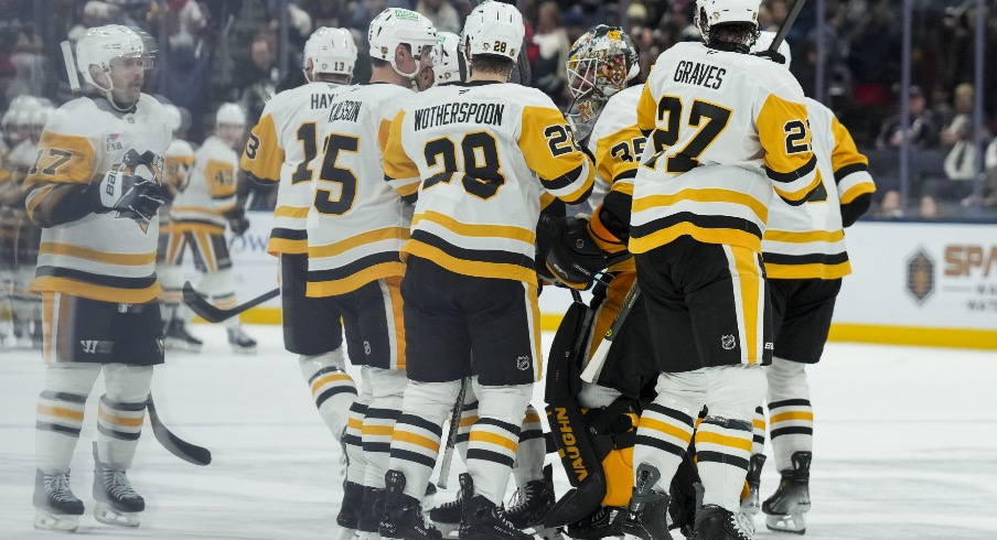 Nov 28, 2025; Columbus, Ohio, USA; Pittsburgh Penguins goaltender Tristan Jarry (35) celebrates with teammates after his team’s win against the Columbus Blue Jackets in the overtime period at Nationwide Arena.