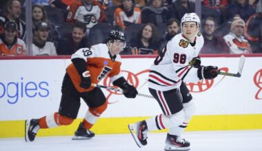 Philadelphia Flyers forward Matvei Michkov pursues Chicago Blackhawks forward Connor Bedard