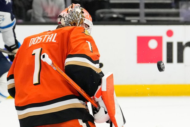 Ducks goaltender Lukas Dostal deflects a shot during the second...