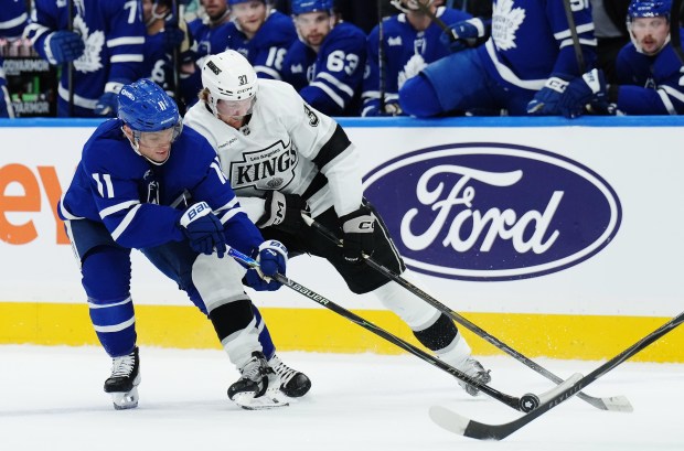 The Toronto Maple Leafs’ Max Domi, left, and the Kings’...