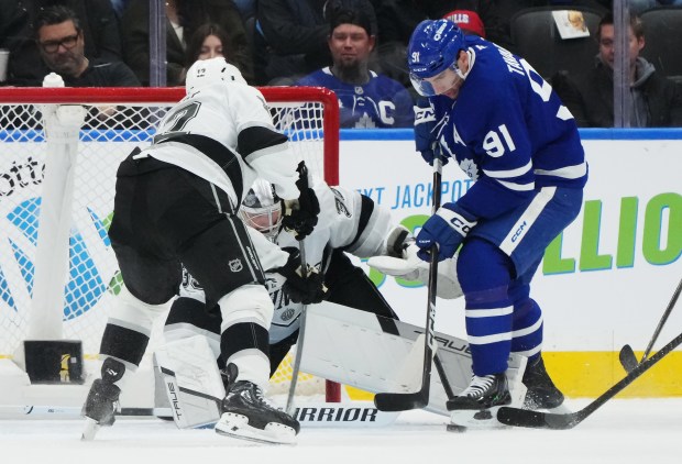 The Toronto Maple Leafs’ John Tavares, right, is denied by...