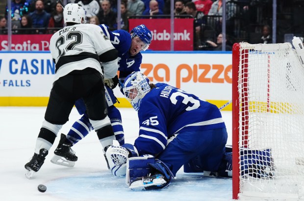 Toronto Maple Leafs goaltender Dennis Hildeby, right, makes a save...