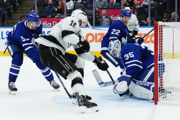 Toronto Maple Leafs goaltender Dennis Hildeby, right, makes a save...