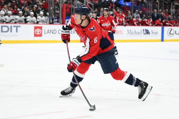 Washington Capitals defenseman Jakob Chychrun shoots during the first period...