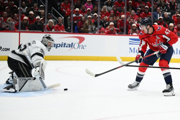 Washington Capitals right wing Tom Wilson shoots against Kings goaltender...