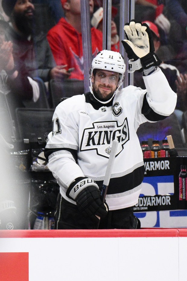 Kings center Anze Kopitar waves as he is recognized during...