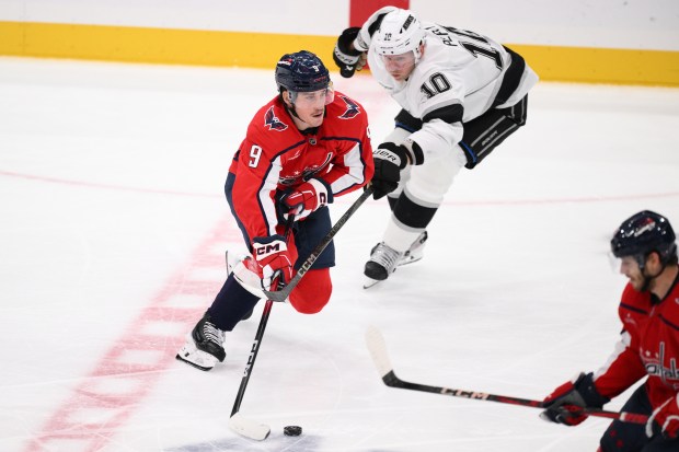 Washington Capitals right wing Ryan Leonard (9) skates with the...