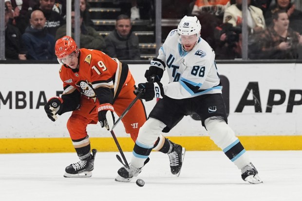Utah Mammoth defenseman Nate Schmidt (88) battles Ducks right wing...