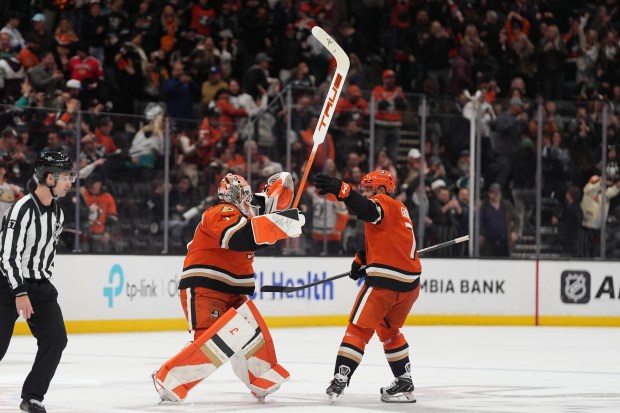 Ducks defenseman Radko Gudas, right, celebrates with goaltender Lukas Dostal...