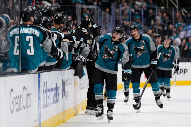San Jose Sharks right wing Adam Gaudette (81) celebrates with...