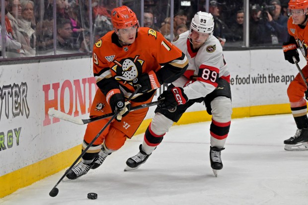 Ducks right wing Troy Terry and Ottawa Senators center Lars...