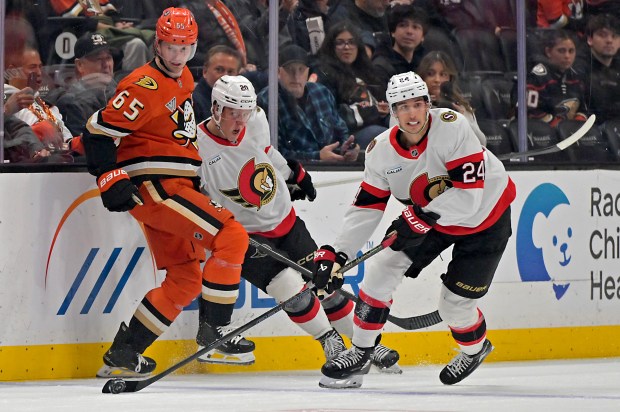 Ottawa Senators left wing Fabian Zetterlund (20) pins Ducks defenseman...