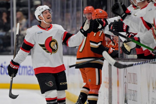 Ottawa Senators center Nick Cousins, left, celebrates after scoring during...