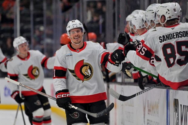 Ottawa Senators center Nick Cousins is congratulated at the bench...