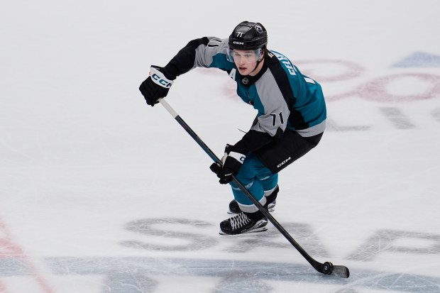 San Jose Sharks center Macklin Celebrini moves the puck during...