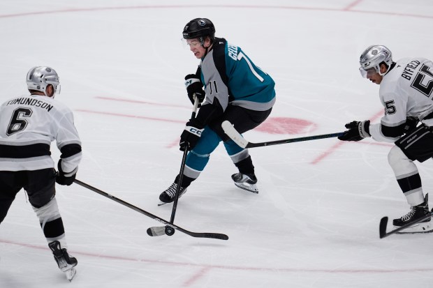 San Jose Sharks center Macklin Celebrini (71) moves the puck...
