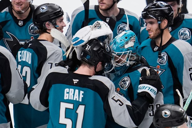 San Jose Sharks goaltender Yaroslav Askarov (30) celebrates with right...