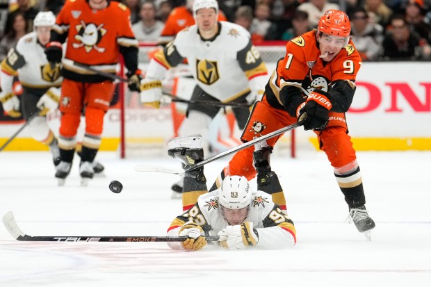 Vegas Golden Knights right wing Mitch Marner, below, and Anaheim...