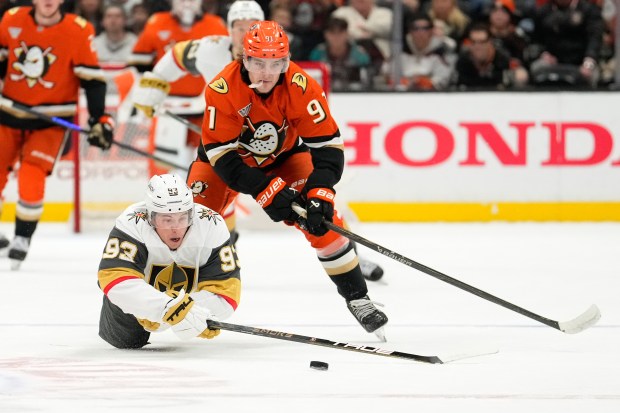 Vegas Golden Knights right wing Mitch Marner, below, and Anaheim...