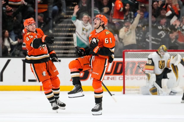 Anaheim Ducks left wing Cutter Gauthier, center, celebrates his game-winning...
