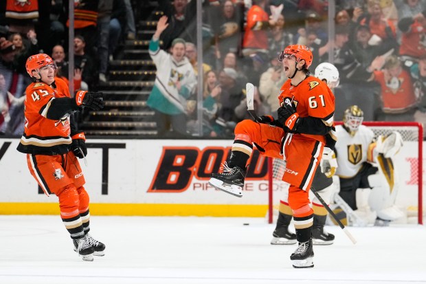 Anaheim Ducks left wing Cutter Gauthier, center, celebrates his game-winning...