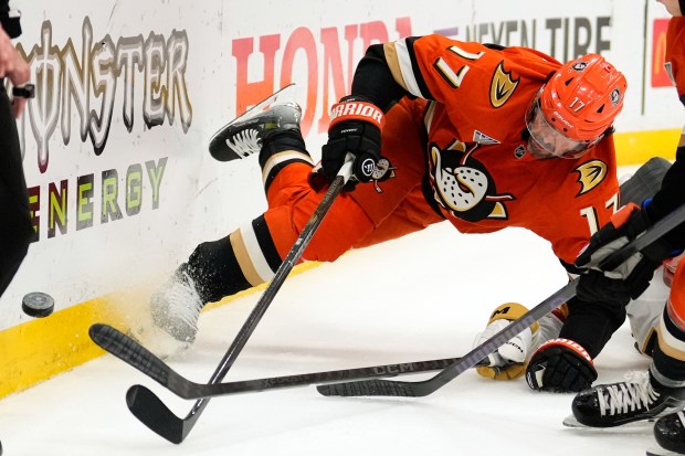 Anaheim Ducks left wing Alex Killorn falls as the goes...