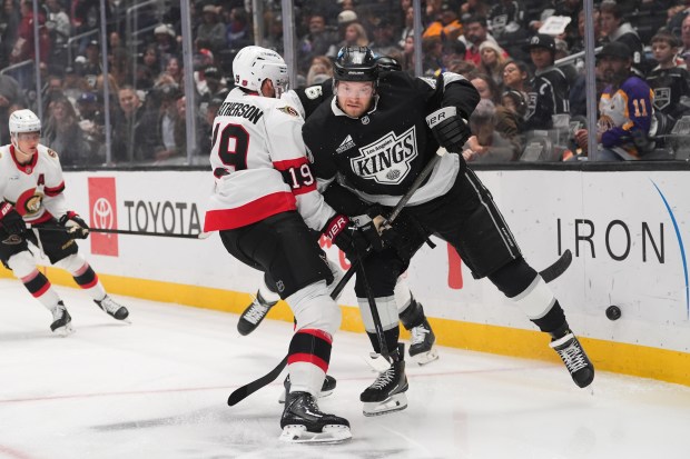 Ottawa Senators right wing Drake Batherson, left, collides with Kings...