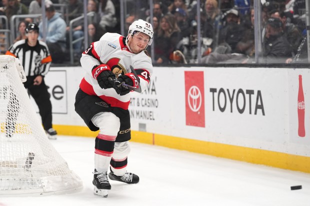 Ottawa Senators defenseman Tyler Kleven hits the puck during the...