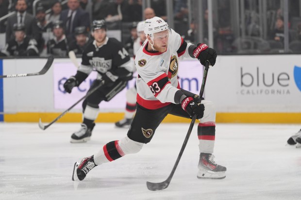 Ottawa Senators defenseman Nikolas Matinpalo fires the puck toward the...