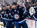 Adam Lowry of the Winnipeg Jets celebrates his goal against the St. Louis Blues in a 2025 NHL playoff game at Canada Life Centre. The Jets and 
Lowry agreed to a five-year contract 
extension worth US $25 million.   