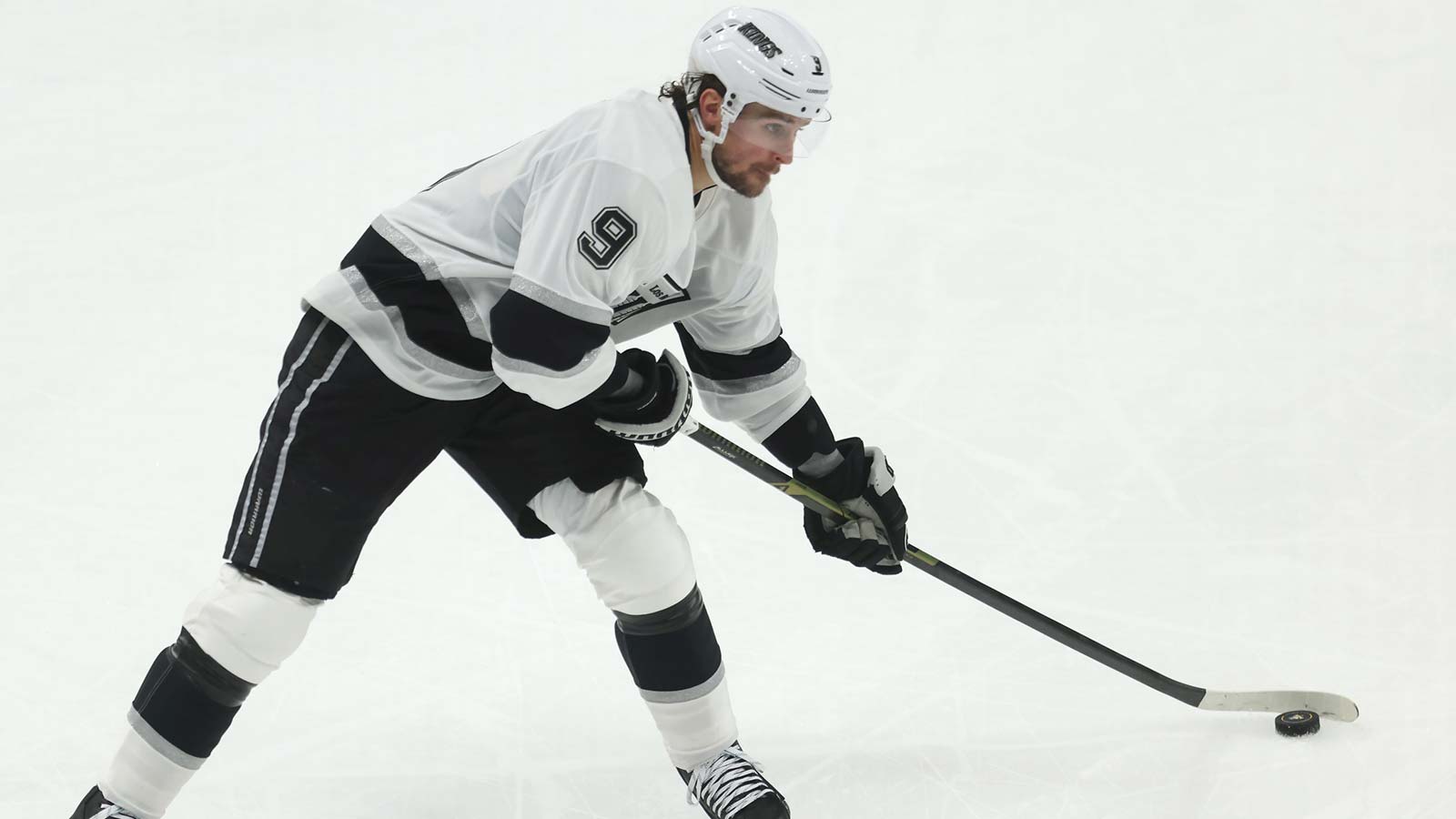 Los Angeles Kings right wing Adrian Kempe (9) shoots the puck against the Pittsburgh Penguins during the third period at PPG Paints Arena.