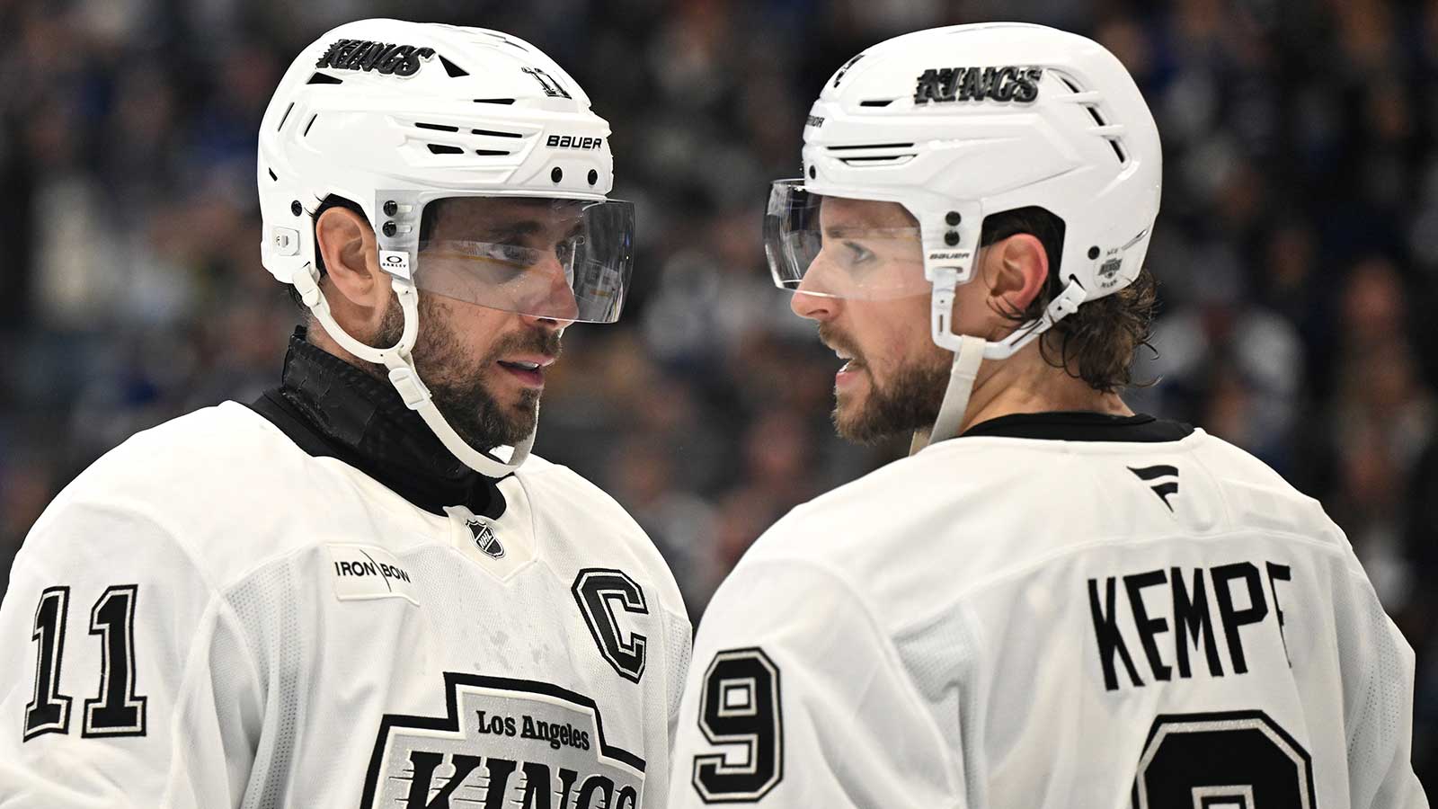  Los Angeles Kings forwards Anze Kopitar (11) and Adrian Kempe (9) talk before a faceoff against the Toronto Maple Leafs in the third period at Scotiabank Arena.
