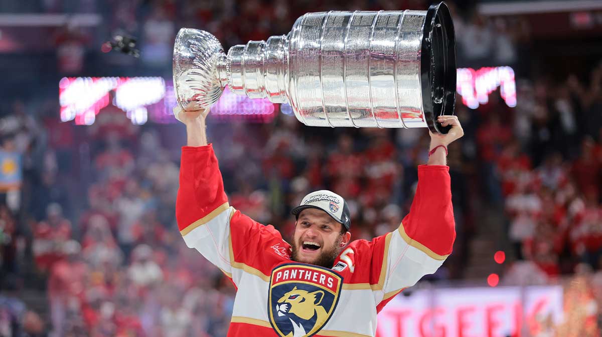 Panthers center Aleksander Barkov (16) hoists the Stanley Cup after winning game six of the 2025 Stanley Cup Final against the Edmonton Oilers at Amerant Bank Arena.