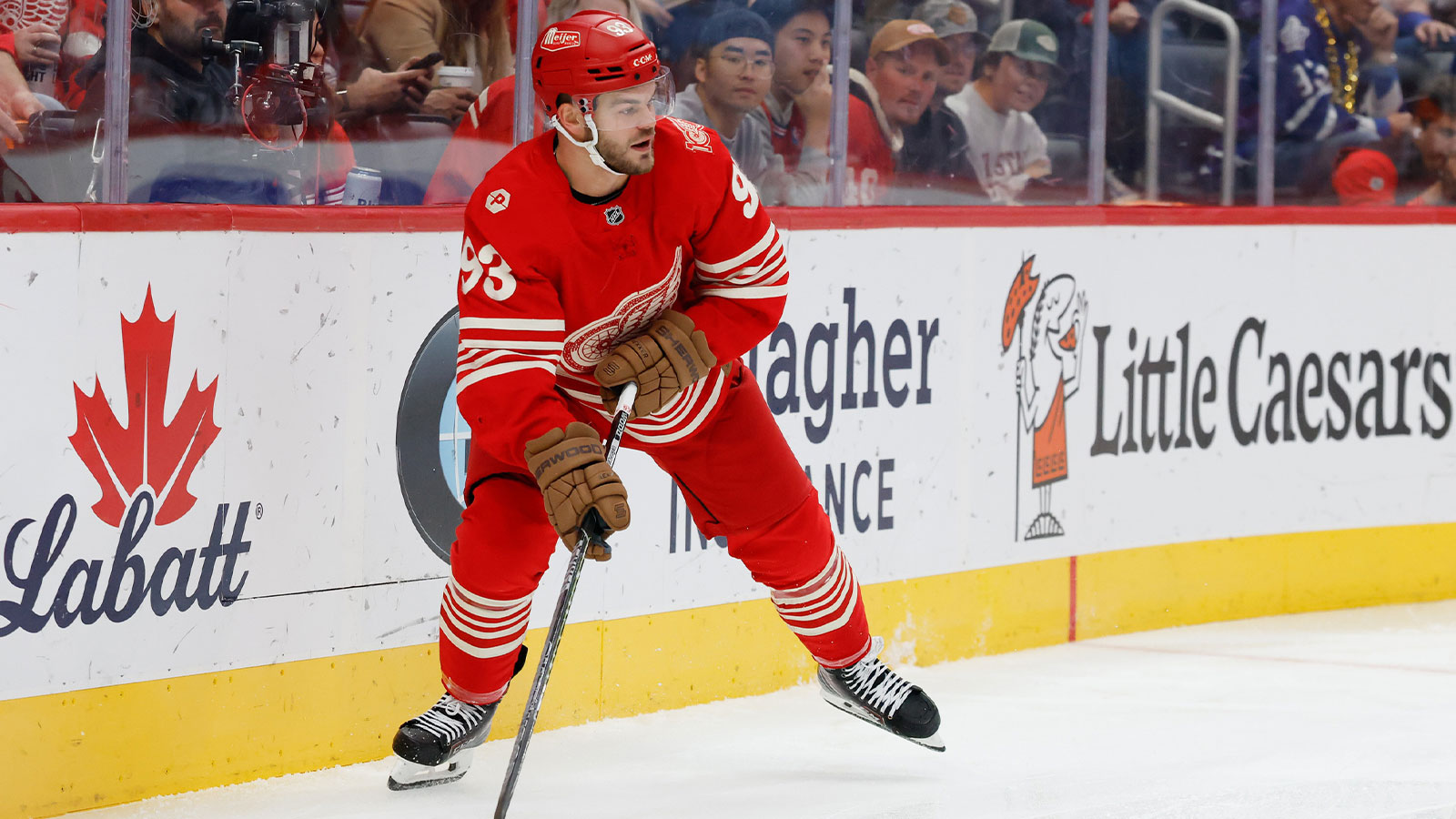 Detroit Red Wings right wing Alex Debrincat (93) skates with the puck in the second period against the Toronto Maple Leafs at Little Caesars Arena.