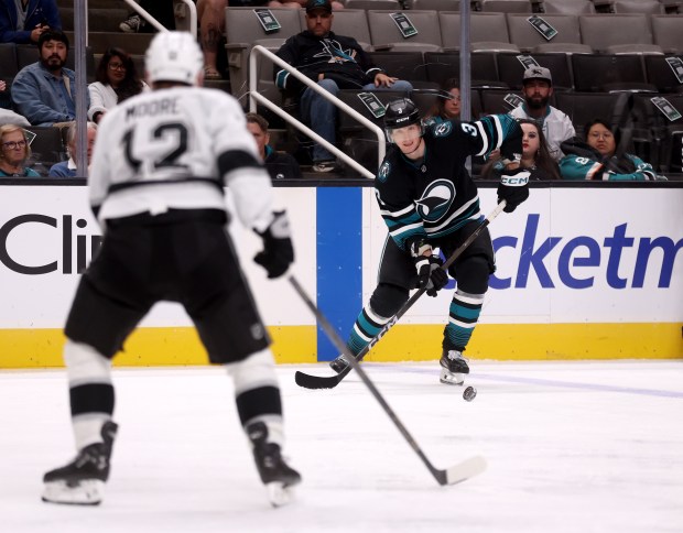 San Jose Sharks’ John Klingberg #3 looks to pass the...