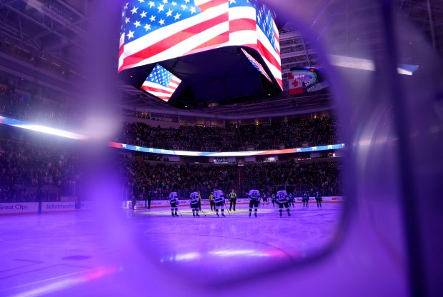 The San Jose Sharks and the Los Angeles Kings stand...