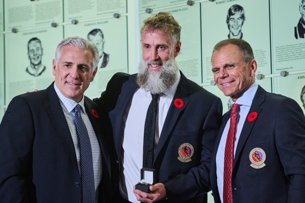Hockey Hall of Fame selection committee chair Ron Francis, left to right, inductee Joe Thornton and chairman Mike Gartner pose for a photograph in Toronto, Saturday, Nov. 8, 2025. (Sammy Kogan/The Canadian Press via AP)