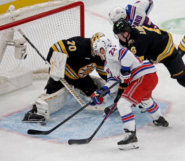 New York Rangers center Jonny Brodzinski (22) drives into Boston Bruins goaltender Joonas Korpisalo at the TD Garden. (Staff Photo By Stuart Cahill/Boston Herald)