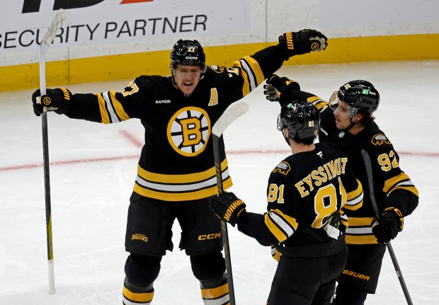 Boston Bruins defenseman Hampus Lindholm (27) celebrates his goal with teammates Michael Eyssimont (81) and Marat Khusnutdinov on Tuesday at the TD Garden. (Staff Photo By Stuart Cahill/Boston Herald)