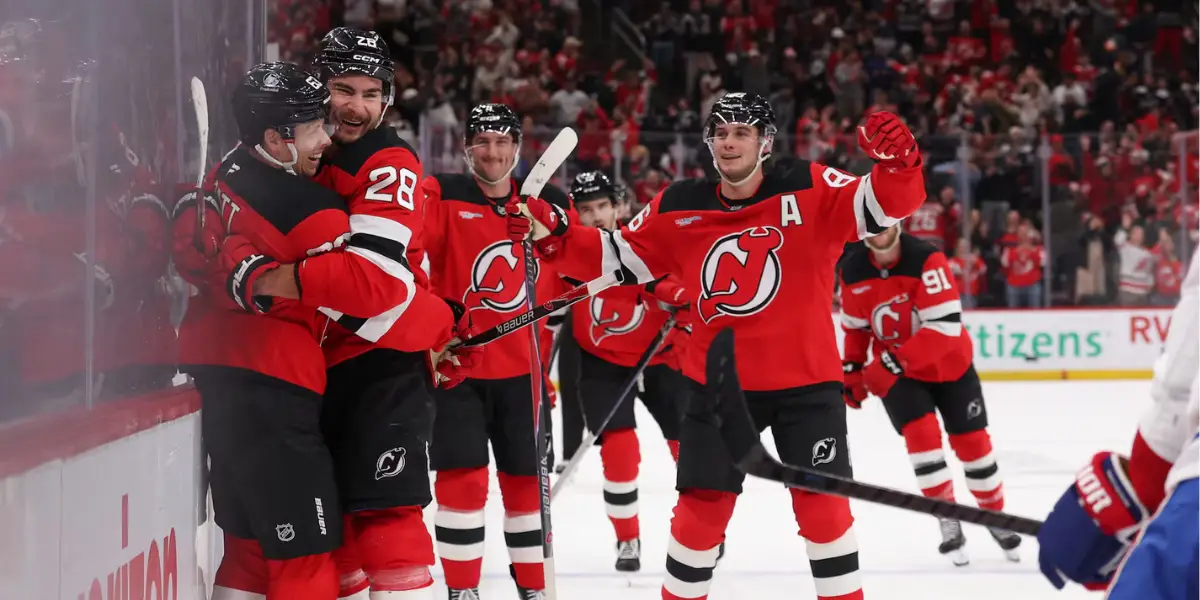 Jesper Bratt and his teammates celebrate his overtime game-winner for the New Jersey Devils against the Montreal Canadiens at the Prudential Center.