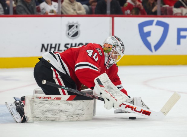 Blackhawks goaltender Arvid Soderblom grabs the puck during the second period against the Calgary Flames, Nov. 18, 2025, at the United Center. (Dominic Di Palermo/Chicago Tribune)