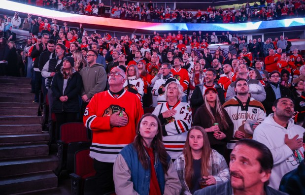Fans sing the National Anthem before a game between the Blackhawks and Calgary Flames, Nov. 18, 2025, at the United Center. (Dominic Di Palermo/Chicago Tribune)